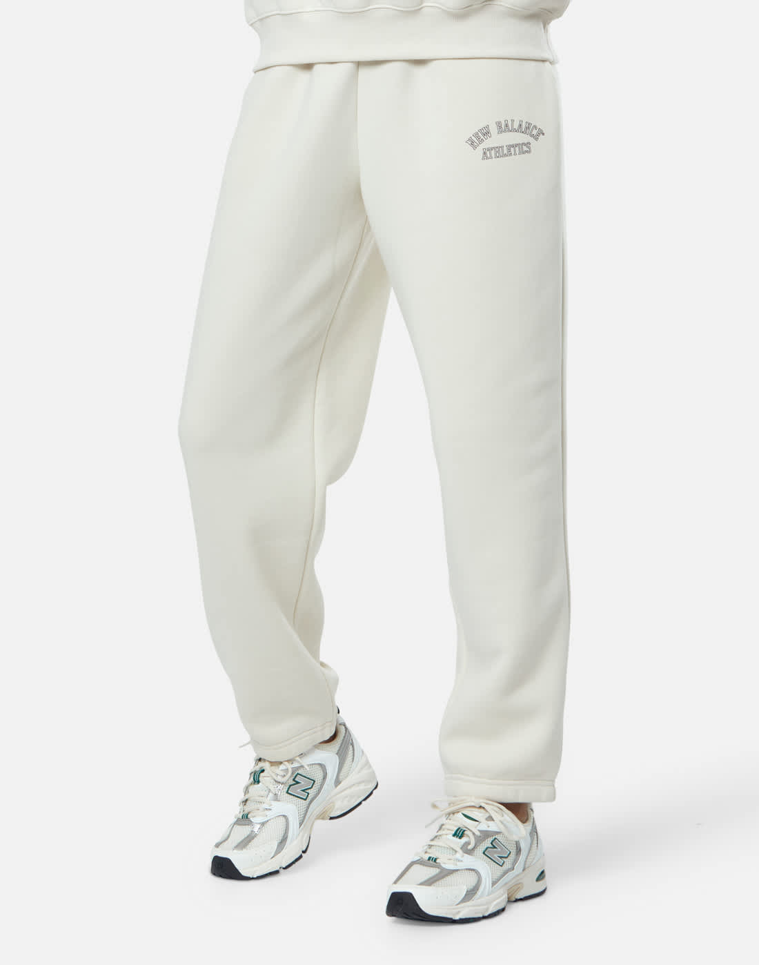 Women's New Balance Fleece Graphic Joggers in Cream | Medium